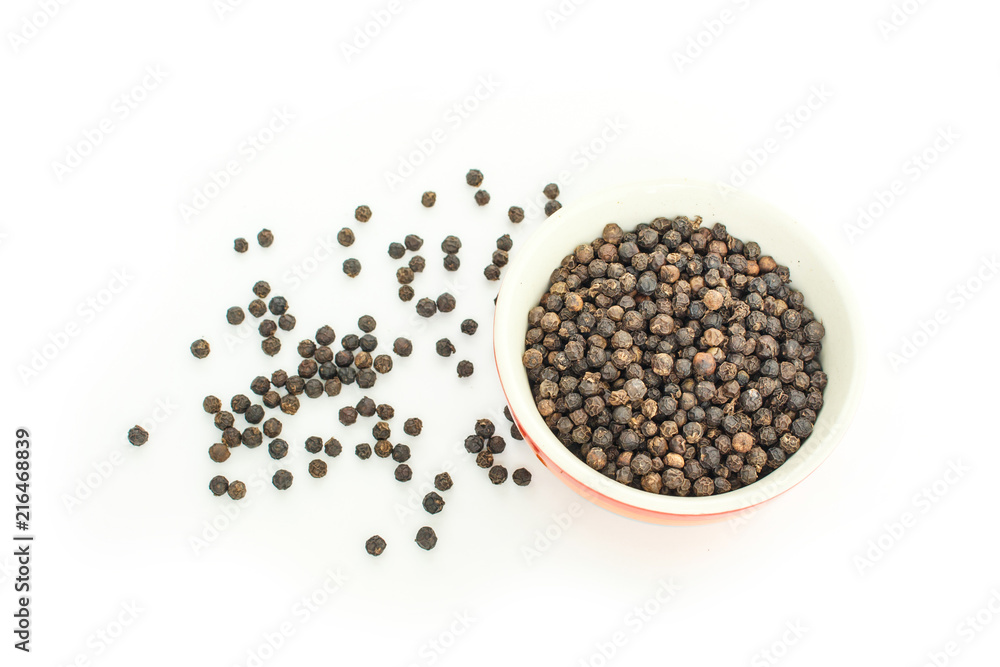 peppercorns in bowl on white background. peppercorns in bowl on white background.