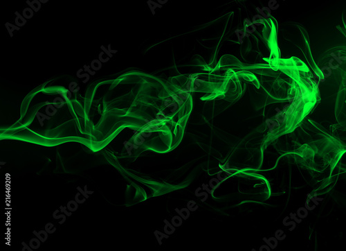 Green Smoke abstract on black background and darkness concept