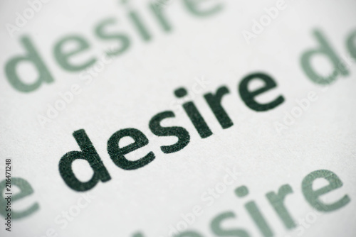 word desire printed on paper macro
