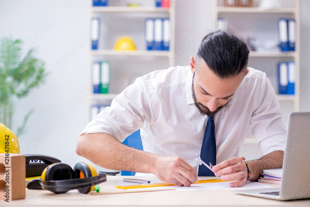 Architect working in his studio on new project Architect working in his studio on new project