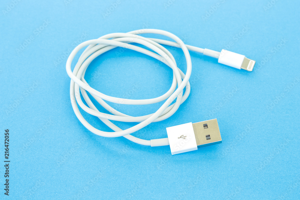 usb cable port charger on blue background usb cable port charger on blue background