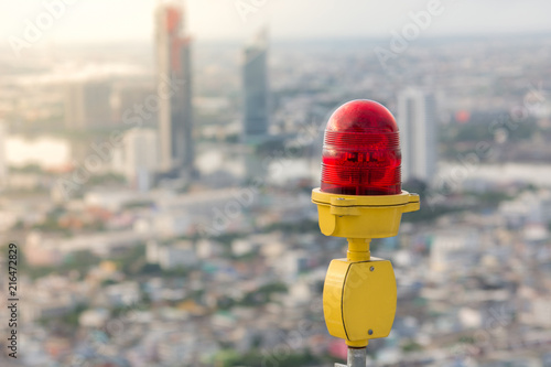 Картината върху платно Obstruction light with city background