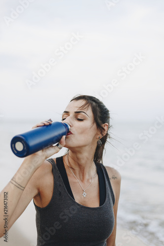 Woman drinking water after a workout