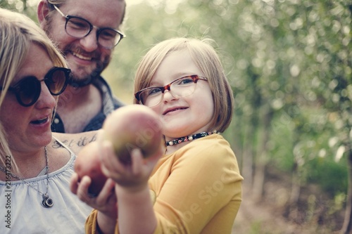 A Caucasian family is spending time at the farm together photo