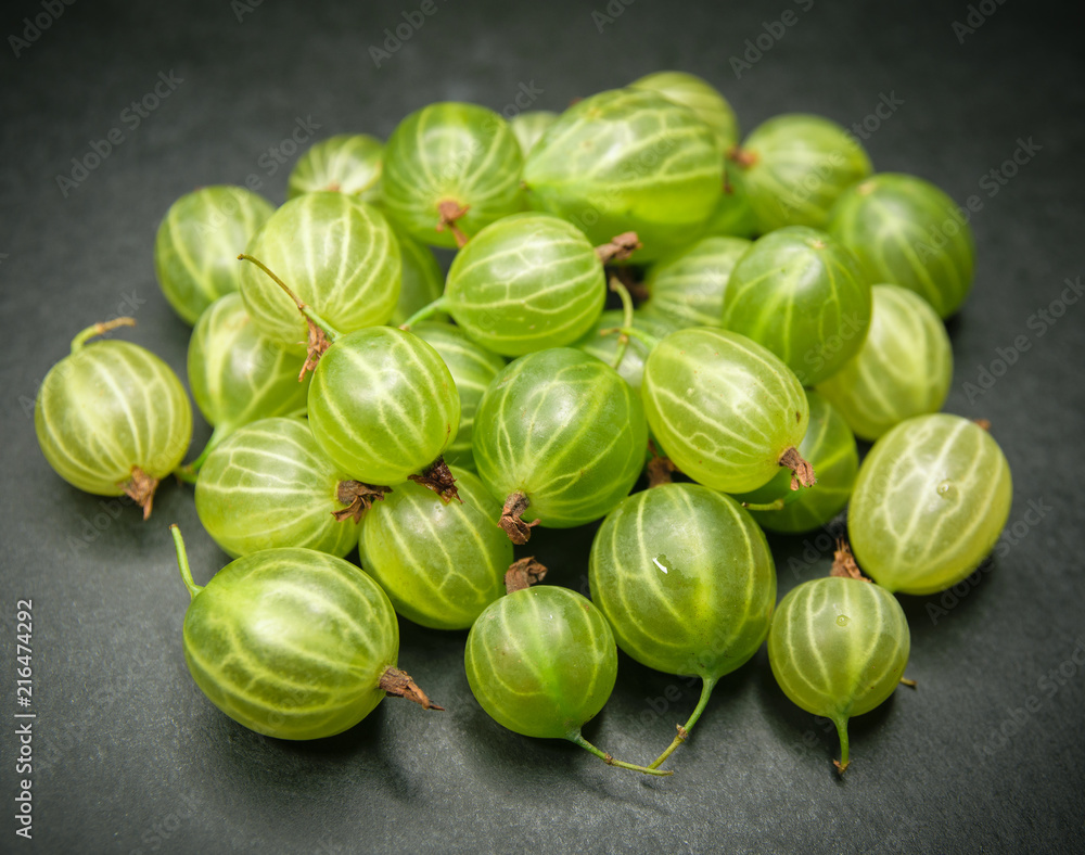 Berries of gooseberries on a dark background. Berries of gooseberries on a dark background.