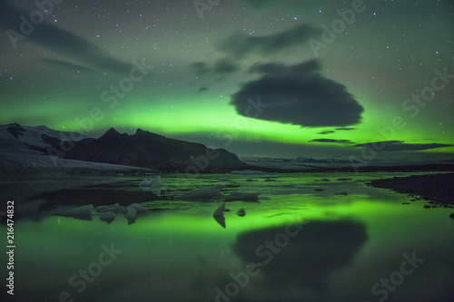 Northern Lights over glacier lagoon in Iceland. Up north northern lights show.