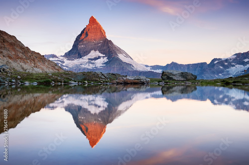 Matterhorn and reflection on the water surface during sunrise. Beautiful natural landscape in the Switzerland