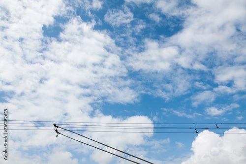 Horns and wiring of a trolleybus against the blue sky