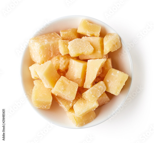 Bowl of parmesan cheese isolated on white background, from above