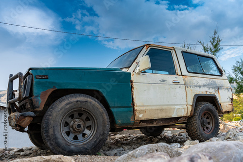 The old rugged off-road vehicle stuck in a rocky terrain © blanke1973