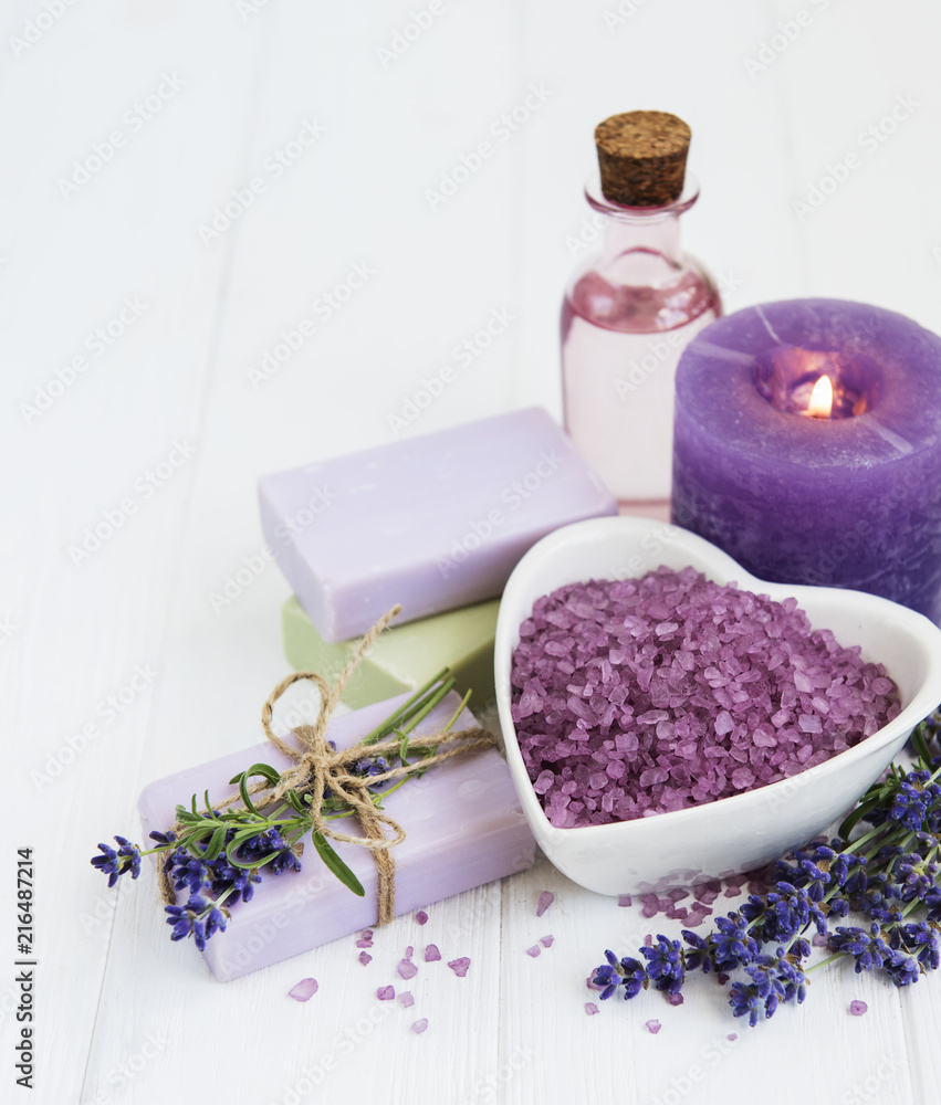 Heart-shaped bowl with sea salt, soap and fresh lavender flowers Heart-shaped bowl with sea salt, soap and fresh lavender flowers