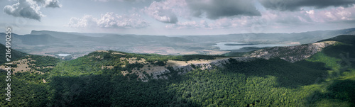 360 panorama aerial view of valley with lake among mountains in summer photo