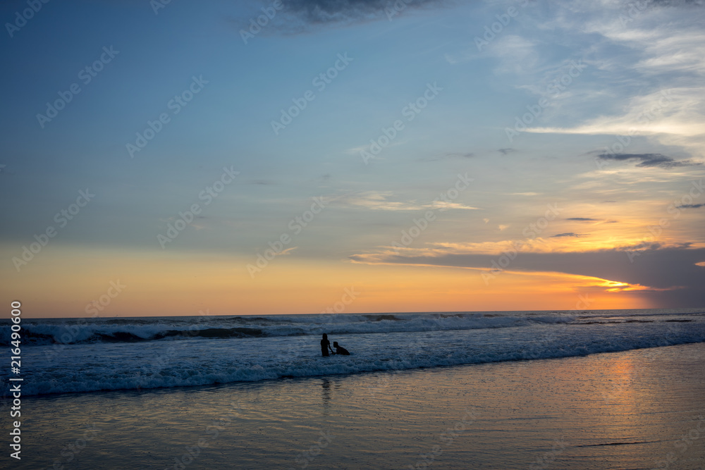 couple on beach at sunset, romantic mood