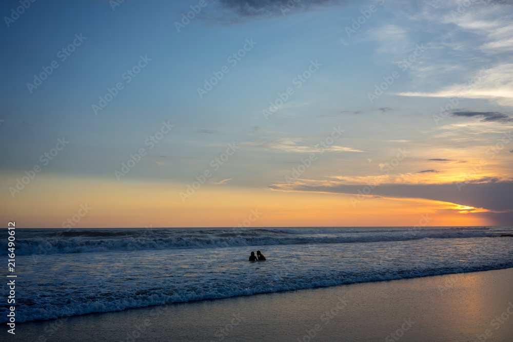 couple on beach at sunset, romantic mood