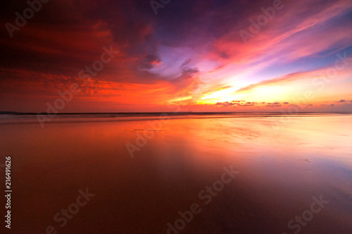 sunrise Seascape with beautiful reflection for background. soft focus due to long expose. © udoikel09