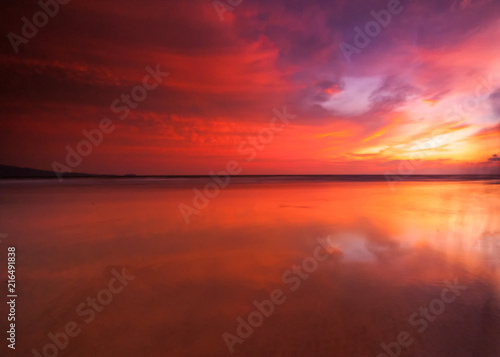 sunrise Seascape with beautiful reflection for background. soft focus due to long expose.