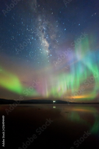 Fototapeta Naklejka Na Ścianę i Meble -  Milkyway with beautiful aurora Borealis. soft focus and noise due to long expose and high iso.