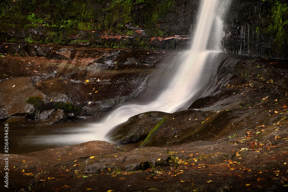 Obraz premium The tall falls at Blaen y Glyn Near Merthyr Tydfil in the South Wales valleys Blaen y Glyn Waterfalls are a series of closely connected falls