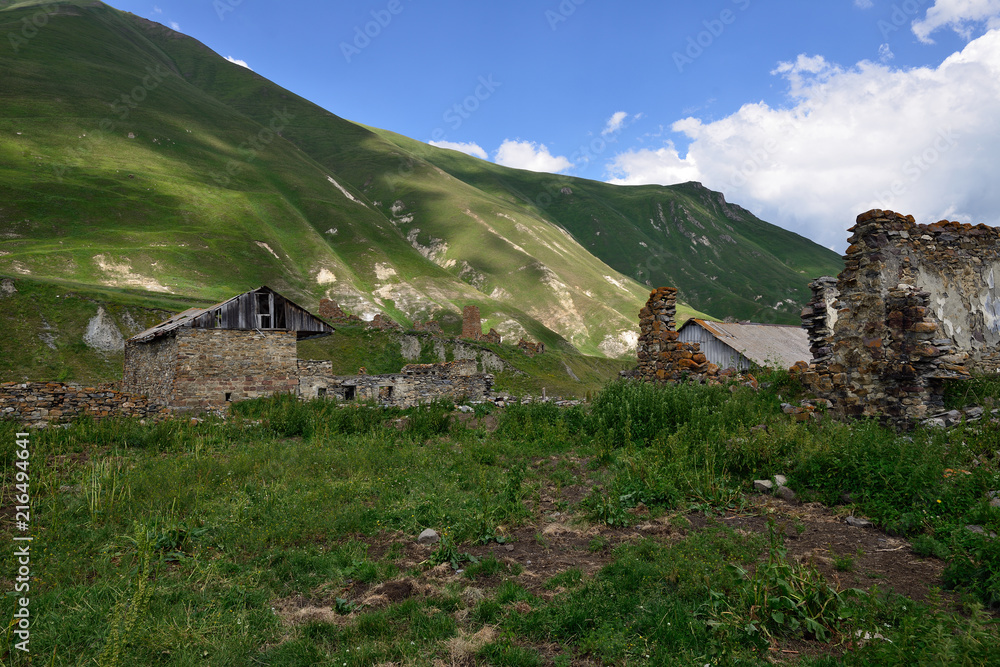 Beautiful Truso Gorge near the Kazbegi city in the mountains of the Caucasus, Ruin old village.