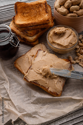 peanut paste on a wooden rustic background