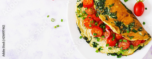 Εκτύπωση καμβά Omelette with tomatoes, spinach and green onion on white plate