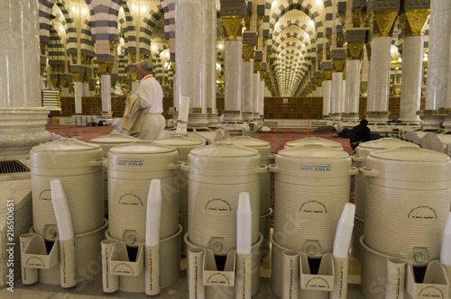 Rows of drums of zamzam water inside Masjid Nabawi in Al Madinah, S. Arabia. Zamzam water are freely and available in abundant here.. photo