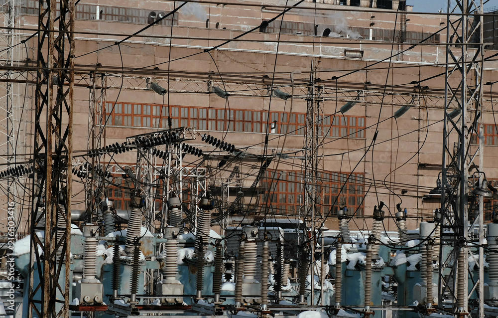 Closeup thermal power station with wires and constructions.