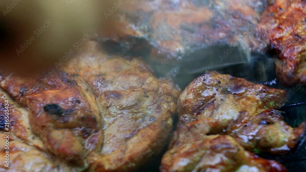 Roasting fresh meat on barbecue closeup Roasting fresh meat on barbecue closeup