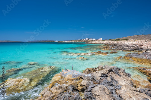 Rocky beach with amazing tranquil water on Paros island, Cyclades, Greece.
