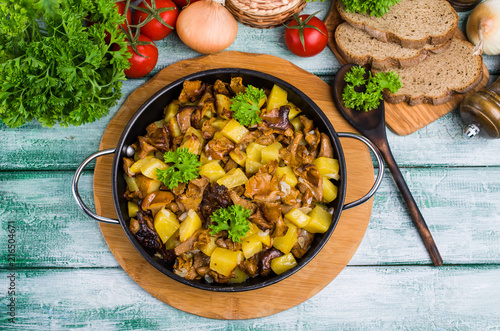 Fried mushrooms with potatoes photo