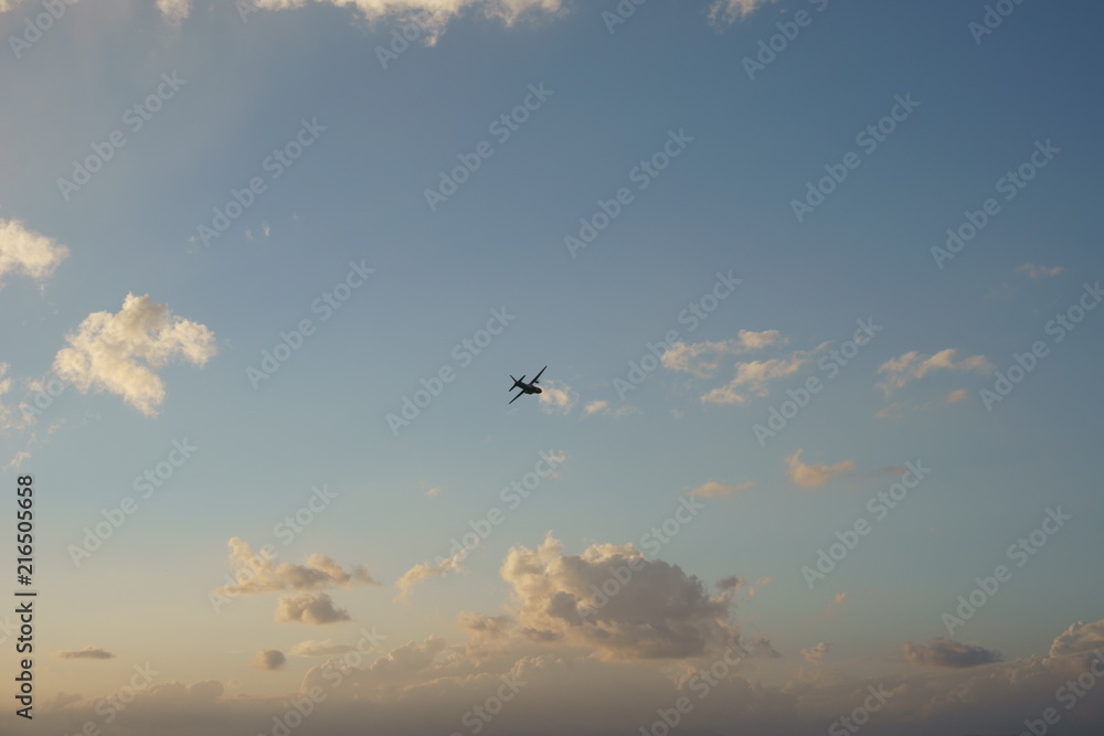 View of a plane gliding in blue sky