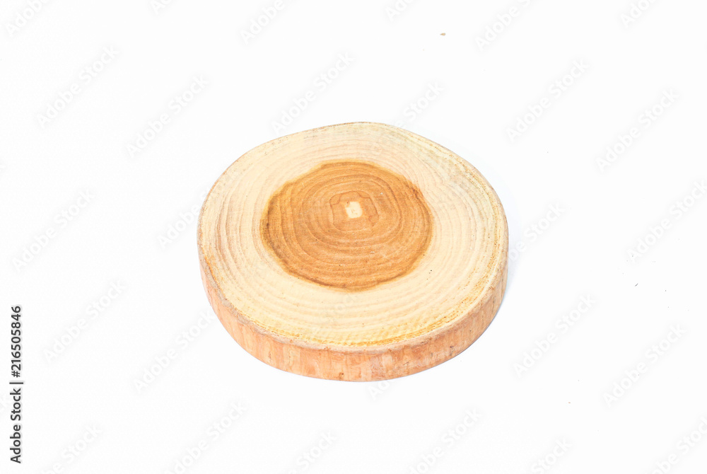 Closeup of single round teak wood on white background Closeup of single round teak wood on white background