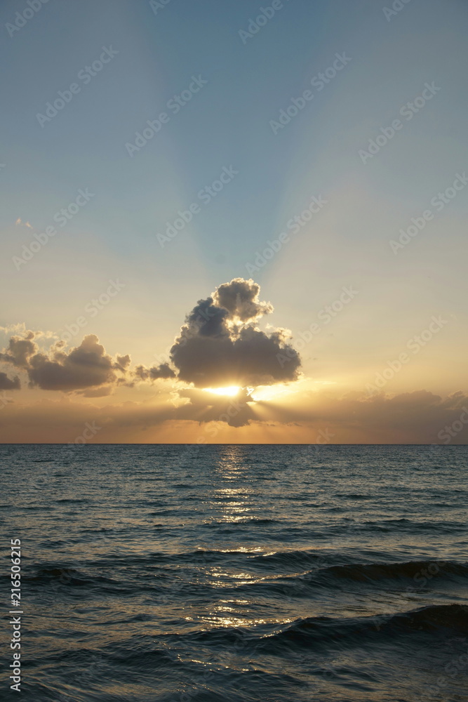 View of clouds over the sea at sunset time