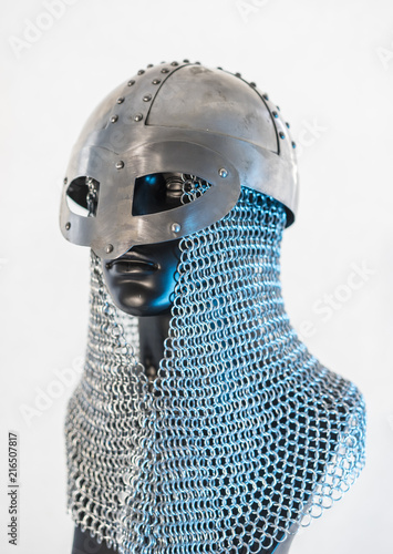 Viking helmet with chain mail in a black mannequin on white background. clothes for the viking war