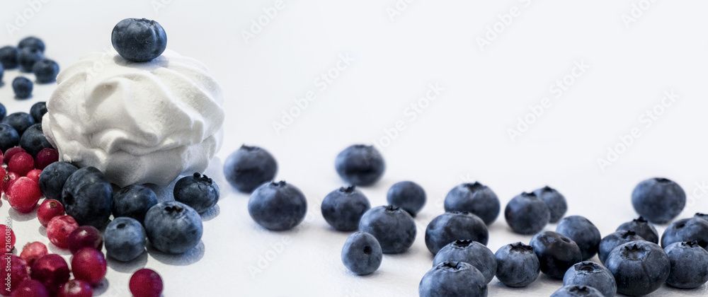 Blueberries and cranberries, berries on a white background. Berry light background. Blueberries and cranberries, berries on a white background. Berry light background.