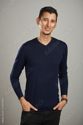Young man with hands in jeans pocket © PixieMe