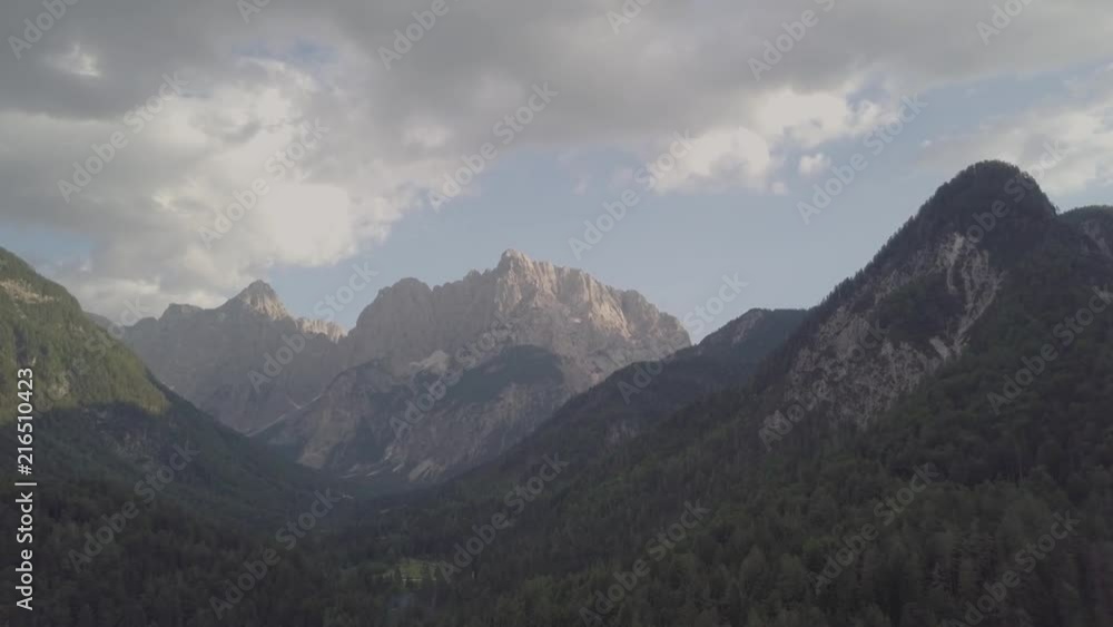 Narrow filght with drone against the mountains. Flying over forrest Narrow filght with drone against the mountains. Flying over forrest