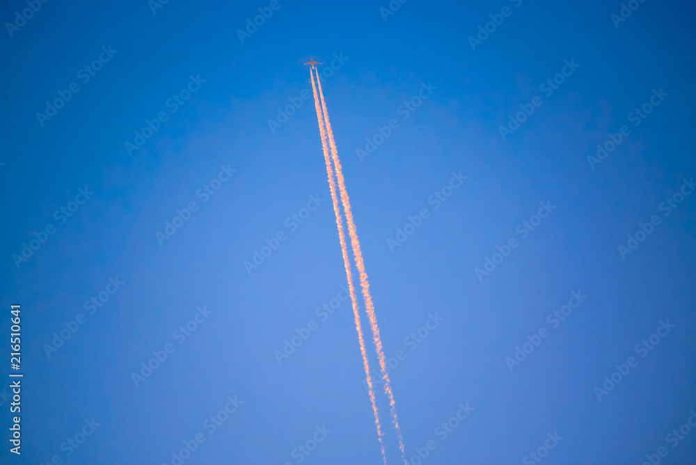 A plane flies high in the sky. A plane flies high in the sky.