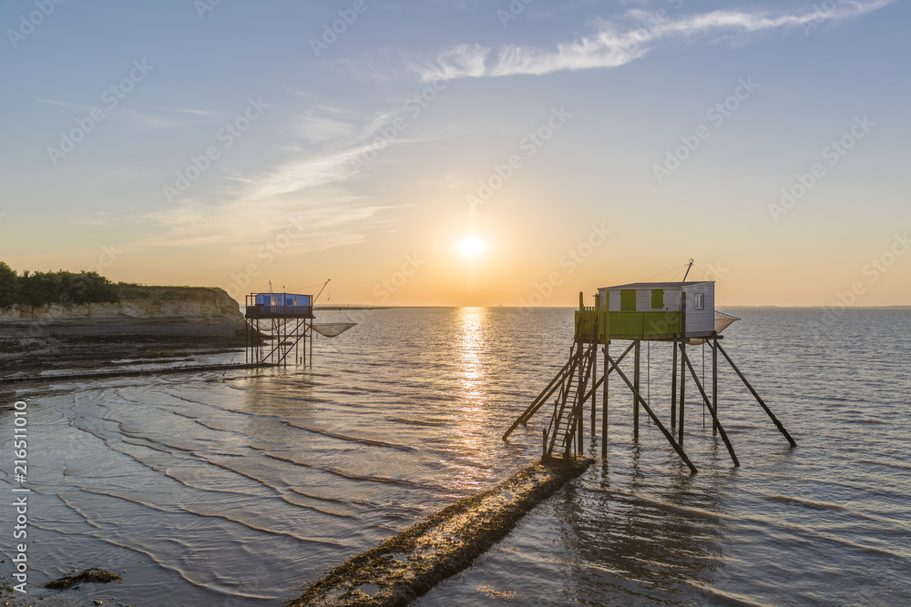 Fishing houses at the Madame island on sunset