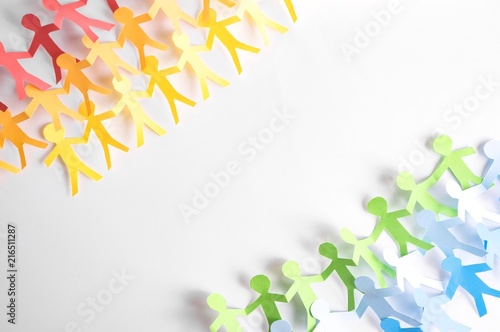 Paper people holding each other in LGBT rainbow colors