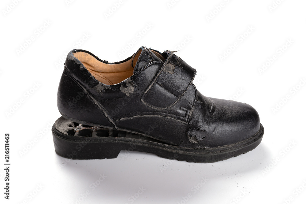 a badly broken leather shoe on white background a badly broken leather shoe on white background