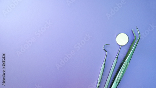 Basic dentist tools isolated on purple or violet background
