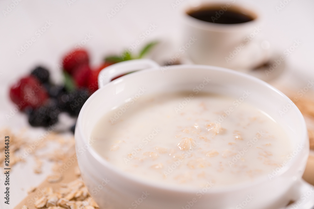 Bowl of oats breakfast cereal with milk Bowl of oats breakfast cereal with milk