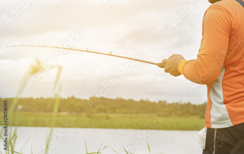 Men are fishing in the marsh. © THEGOT
