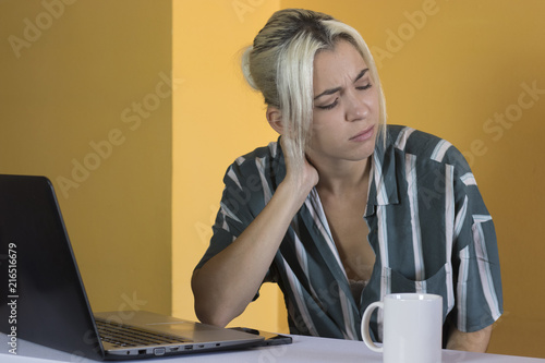 Office worker suffering neck pain photo