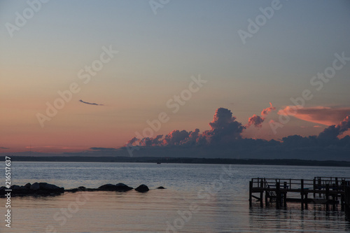 Sunsets in summer with thunderstorms brewing in Long Island Sound, New York photo