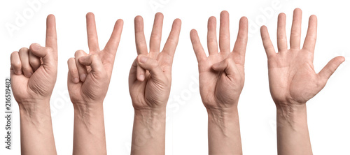 Hands showing number signs from 1 to 5, isolated on white background photo