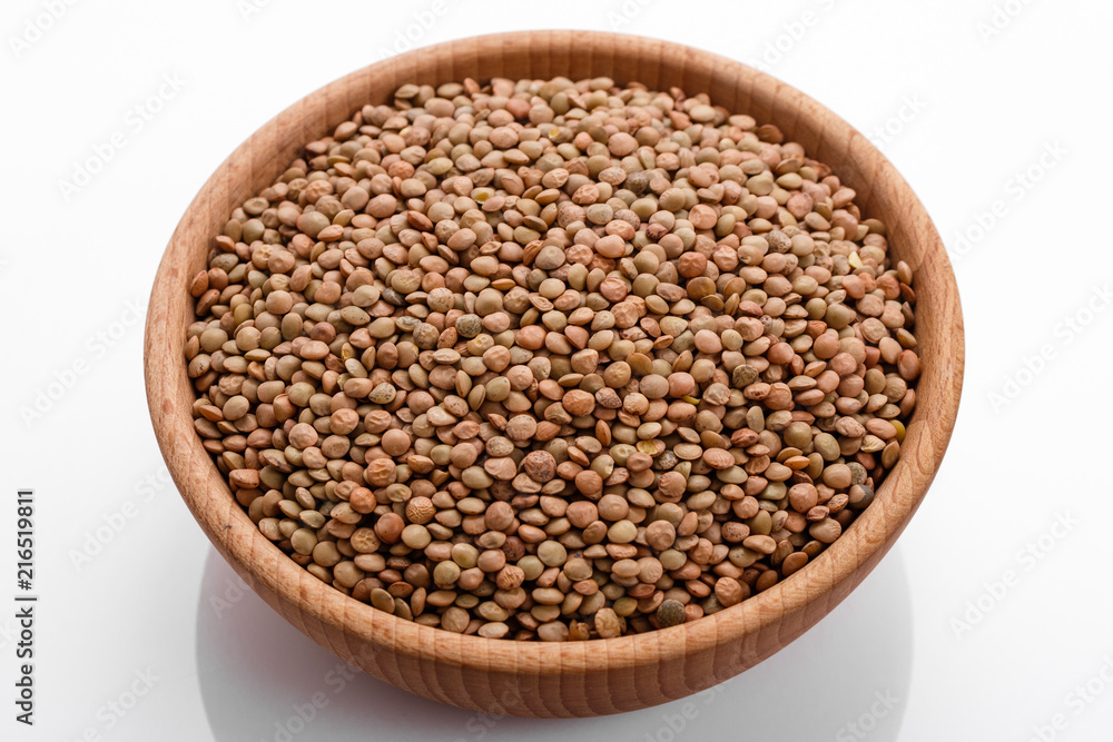 raw lentils on a white acrylic background raw lentils on a white acrylic background