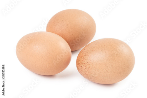 Three brown eggs, isolated on white background