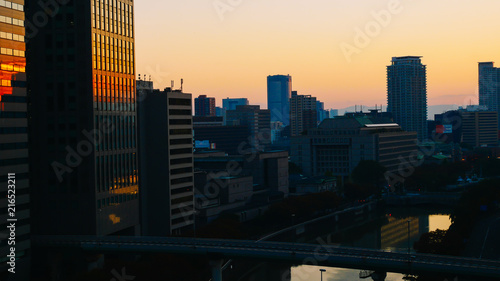 Business Ideas for Real Estate - City scape, Silhouette of building with sunlight in morning.